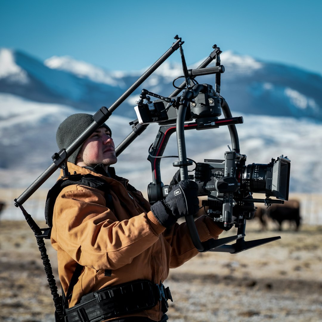 Technician configuring a professional video camera