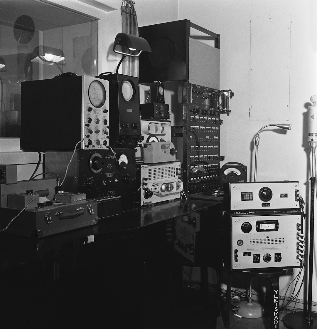 Trainer explaining broadcast equipment to a trainee